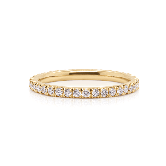 18K yellow gold eternity ring with sparkling lab-grown diamonds in a mesmerizing comet tail design. Front view on white background.