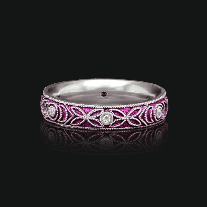 4mm titanium ring with deep purple anodized finish, featuring intricate floral and vine engraving with six 1.3mm bezel-set white moissanites, displayed on a black background.