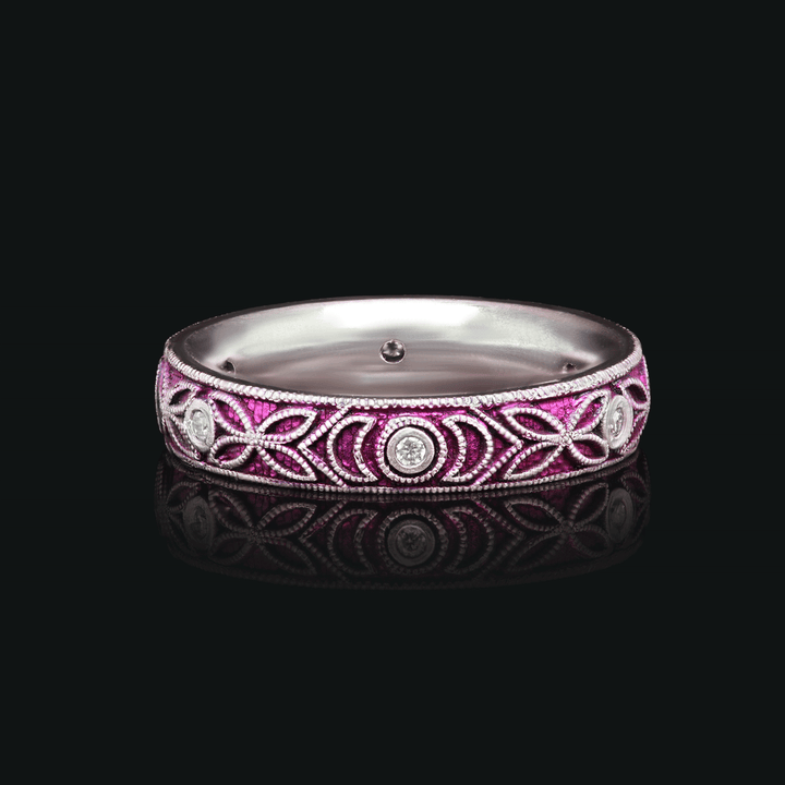 4mm titanium ring with purple anodized finish, featuring intricate floral engraving and six 1.3mm round white moissanite stones in bezel settings, designed for an active lifestyle and crafted with a blend of laser and hand engraving for a unique, vibrant look. seen on black background