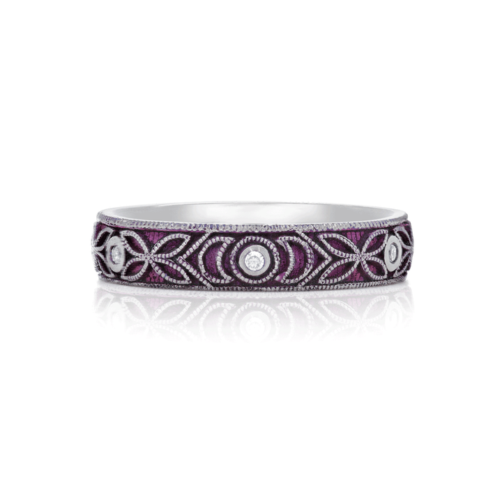 4mm titanium ring with purple anodized finish, featuring intricate floral and moon engraving. Includes six 1.3mm round white moissanite stones in bezel settings, designed for an active lifestyle and crafted with a blend of laser and hand engraving for a unique, vibrant look. On white background.