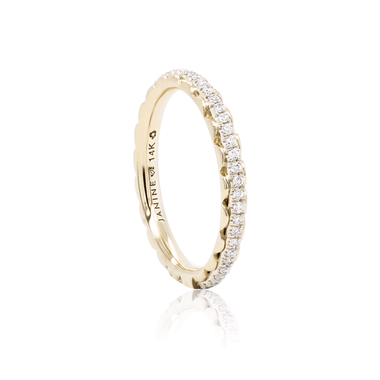 Two-tone eternity band with lab-grown diamonds. Delicate yellow gold details frame the white gold center. 